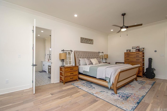 bedroom with recessed lighting, ensuite bathroom, ornamental molding, light wood-type flooring, and baseboards