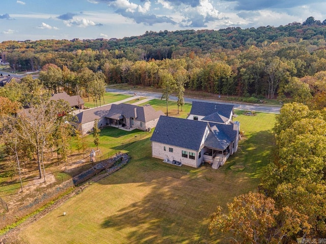 drone / aerial view with a view of trees