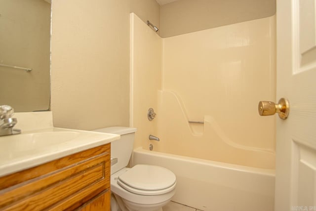 full bathroom featuring washtub / shower combination, vanity, toilet, and tile patterned floors