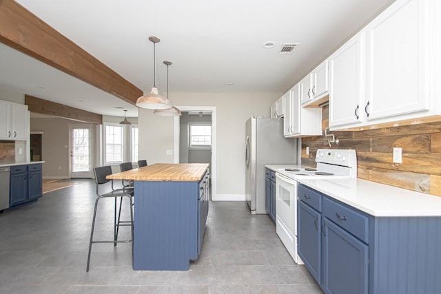 kitchen featuring pendant lighting, stainless steel appliances, white cabinets, a kitchen island, and blue cabinets