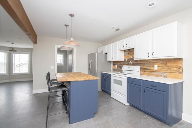 kitchen featuring white electric range oven, a kitchen island, blue cabinetry, white cabinetry, and pendant lighting