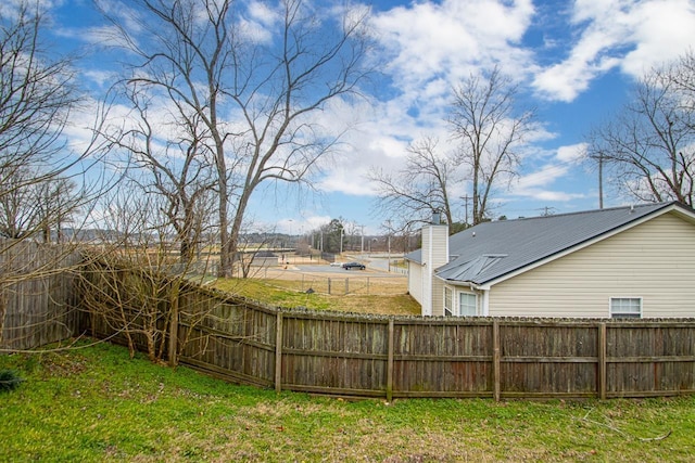 view of yard with a fenced backyard