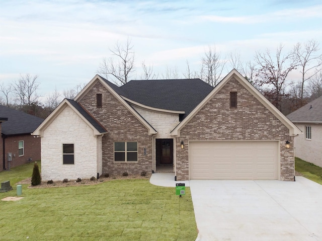 view of front of house with a garage, brick siding, driveway, and a front lawn