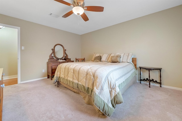 bedroom with light carpet, baseboards, visible vents, and ceiling fan