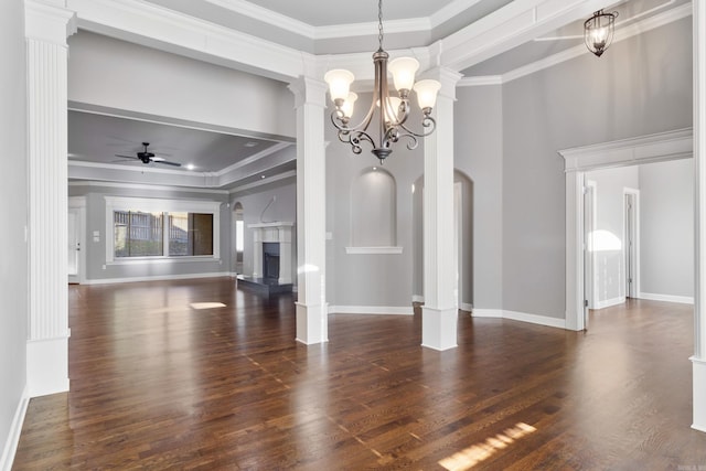 unfurnished living room with a ceiling fan, a fireplace with raised hearth, crown molding, and dark wood-type flooring