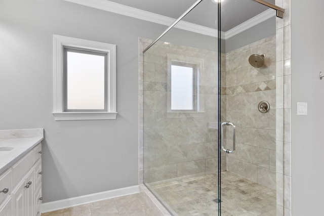 full bath with a shower stall, baseboards, crown molding, and vanity