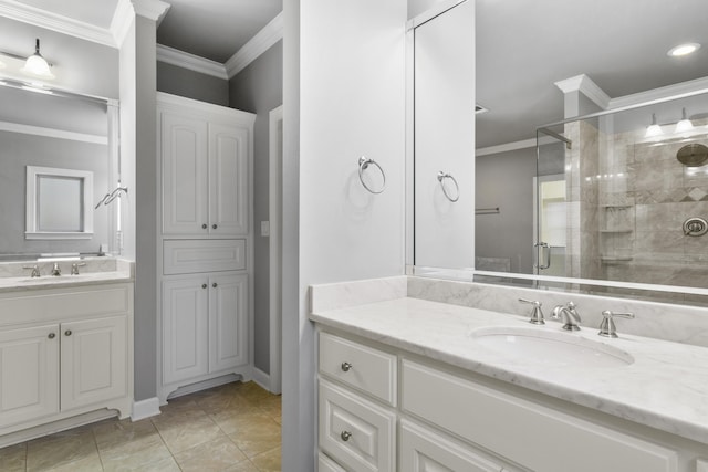 bathroom with two vanities, a sink, ornamental molding, a shower stall, and tile patterned floors