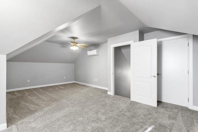 additional living space with carpet floors, lofted ceiling, a ceiling fan, and a wall mounted air conditioner