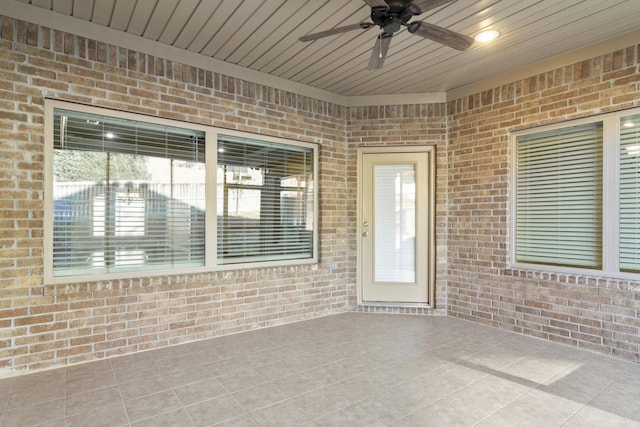 interior space with ceiling fan