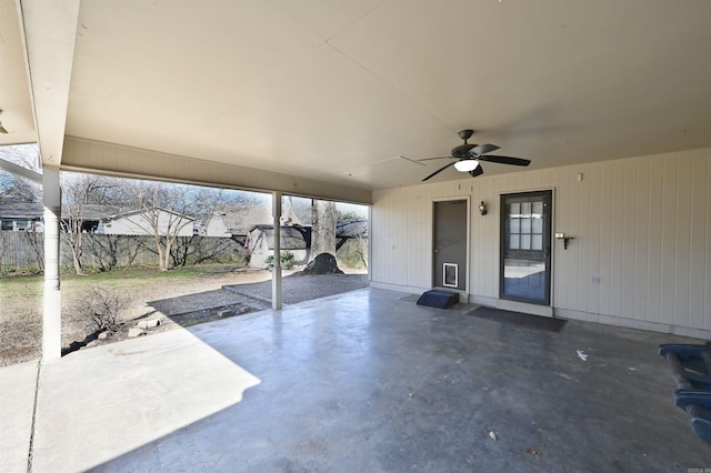 view of patio with a ceiling fan and fence