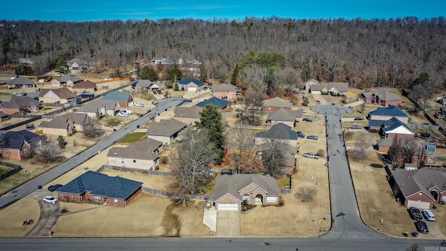 aerial view with a residential view and a wooded view