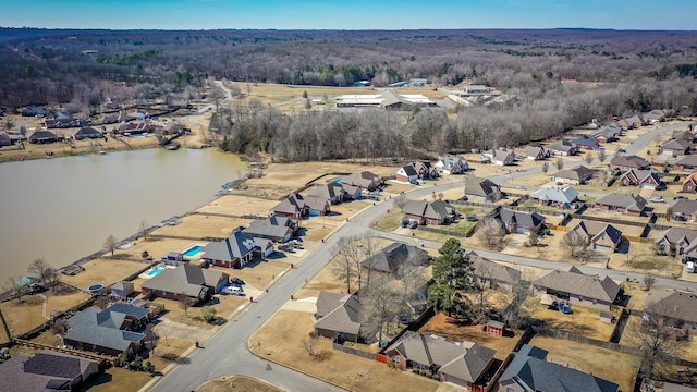 drone / aerial view featuring a water view and a residential view