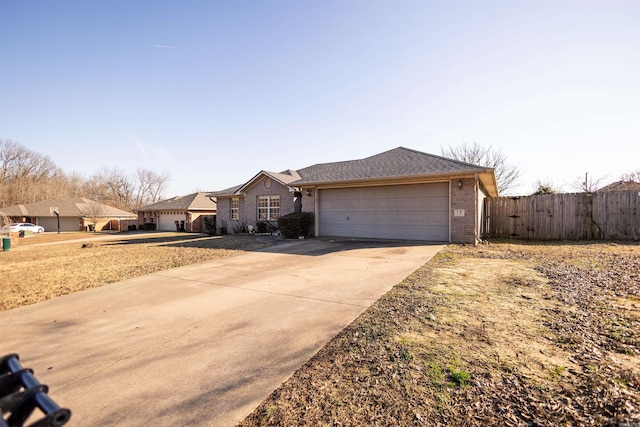 ranch-style home featuring driveway, a residential view, an attached garage, fence, and brick siding