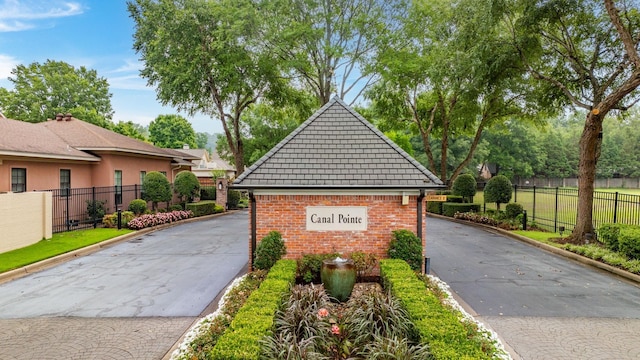 exterior space featuring brick siding and fence