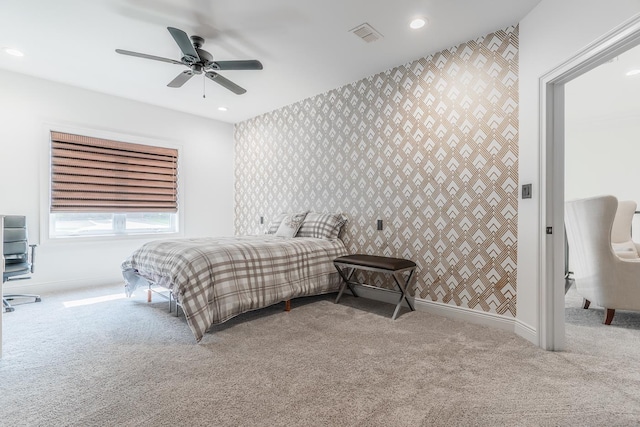 bedroom featuring recessed lighting, light colored carpet, visible vents, baseboards, and wallpapered walls