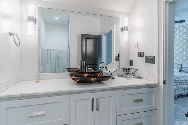 bathroom featuring connected bathroom and vanity