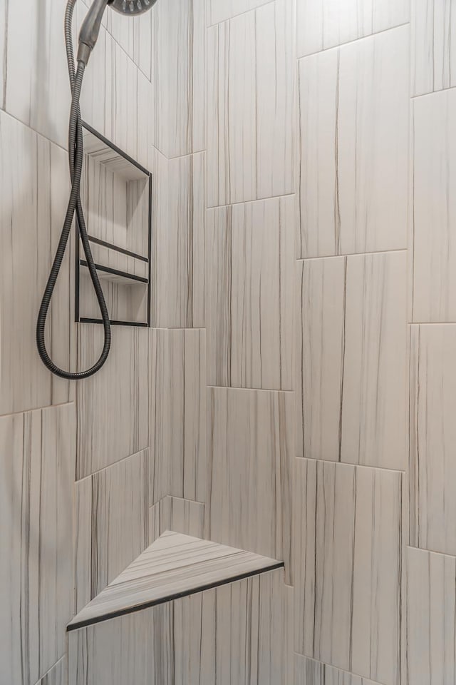 interior details with a sauna and a tile shower