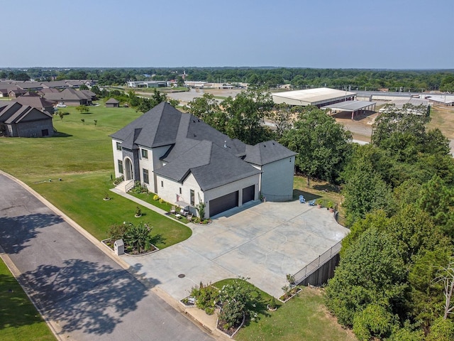 birds eye view of property with a residential view