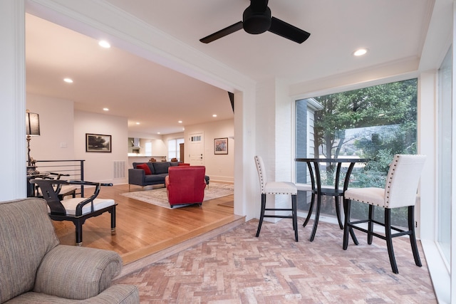 living area with recessed lighting, visible vents, and plenty of natural light