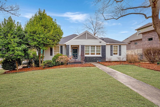 view of front of house featuring stone siding and a front yard