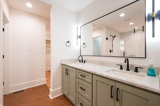 bathroom featuring a stall shower, a sink, visible vents, and recessed lighting