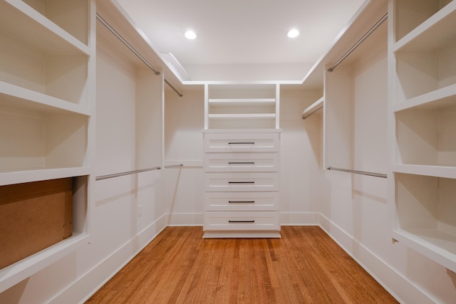 walk in closet featuring light wood finished floors