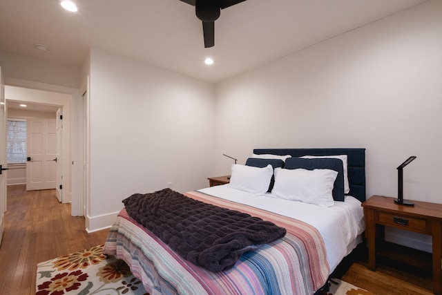 bedroom featuring baseboards, a ceiling fan, wood finished floors, and recessed lighting