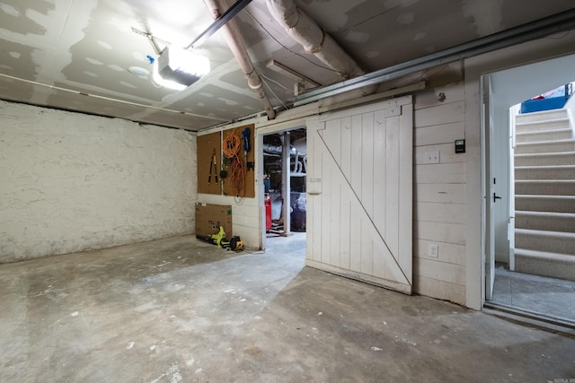 unfinished basement with stairway