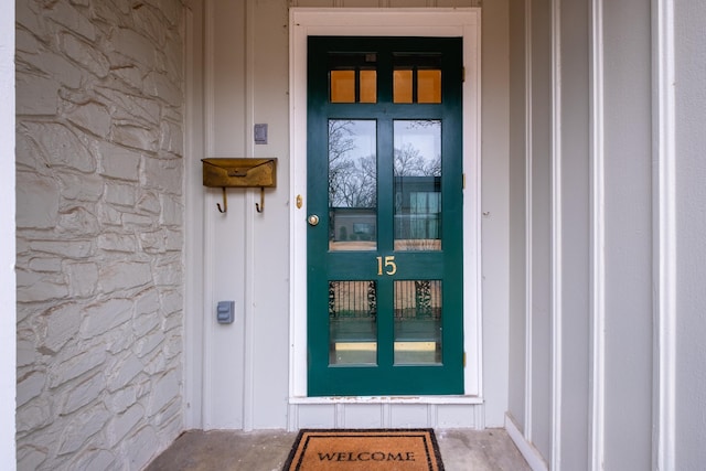 view of exterior entry featuring stone siding