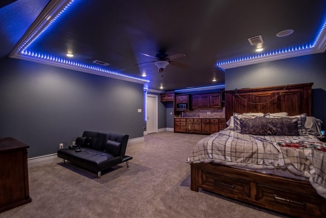 carpeted bedroom featuring ornamental molding, visible vents, and baseboards