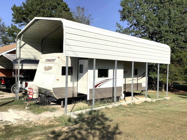 view of outbuilding with a carport