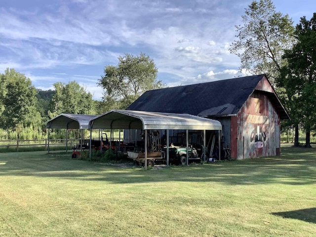 view of barn with a lawn