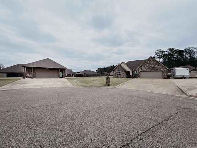 french country style house with a garage, driveway, and a front yard