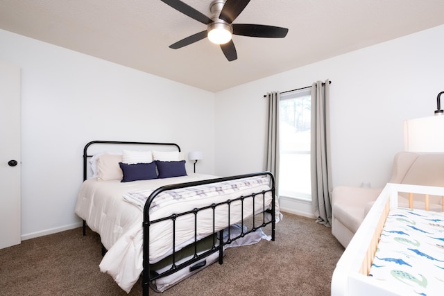 carpeted bedroom featuring a ceiling fan and baseboards