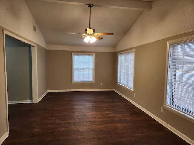 unfurnished room featuring visible vents, baseboards, ceiling fan, dark wood-style flooring, and vaulted ceiling with beams