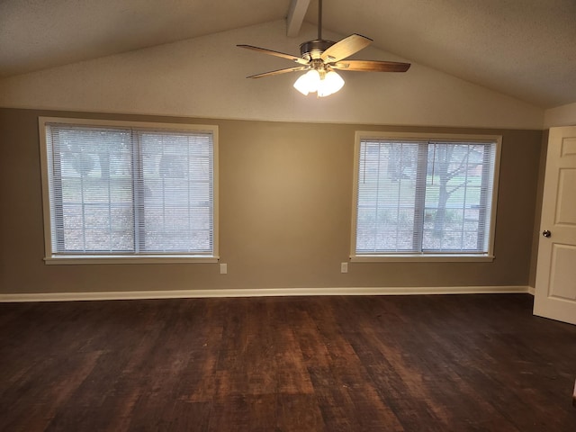 spare room with vaulted ceiling with beams, ceiling fan, baseboards, and dark wood-type flooring