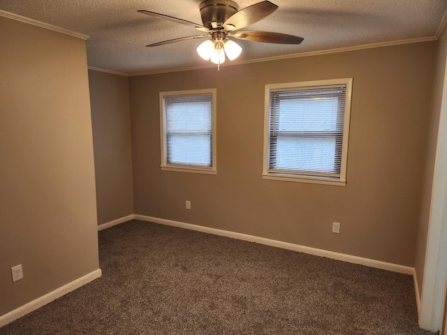 unfurnished room featuring ornamental molding, dark colored carpet, a textured ceiling, and baseboards