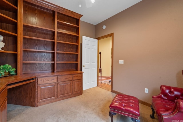 unfurnished room with light carpet and baseboards