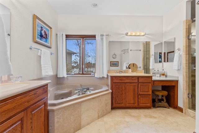 bathroom with a bath, a stall shower, a sink, and two vanities