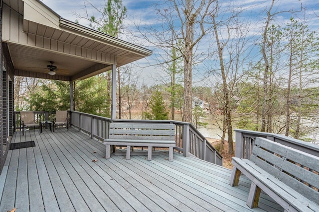 wooden deck with a ceiling fan
