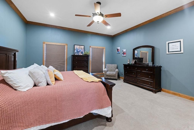bedroom featuring baseboards, ceiling fan, light colored carpet, and crown molding