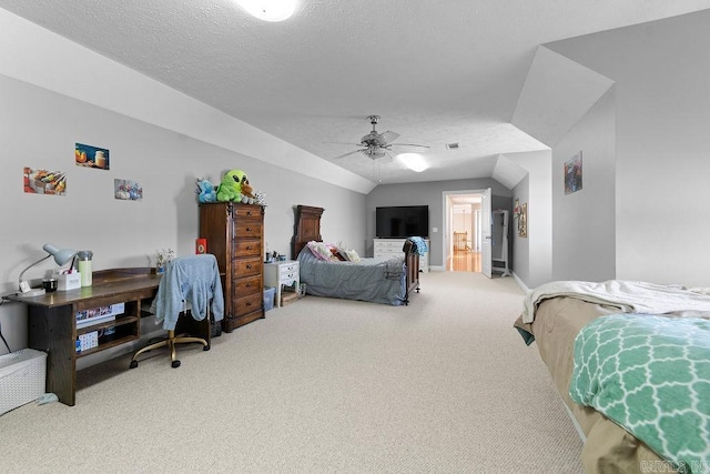 carpeted bedroom with lofted ceiling, ceiling fan, a textured ceiling, and baseboards