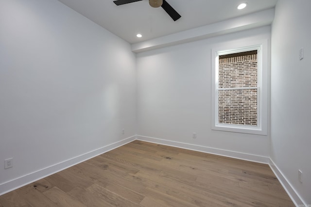 empty room featuring ceiling fan, light wood finished floors, recessed lighting, and baseboards
