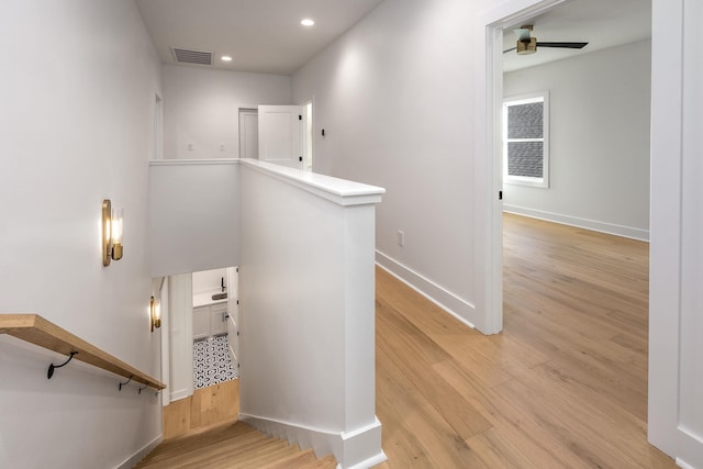 staircase featuring recessed lighting, visible vents, a ceiling fan, wood finished floors, and baseboards