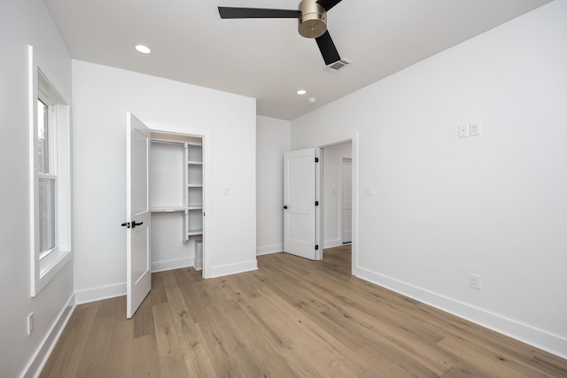 unfurnished bedroom featuring light wood-style floors, baseboards, visible vents, and recessed lighting