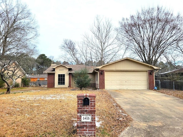 single story home with concrete driveway, brick siding, fence, and an attached garage