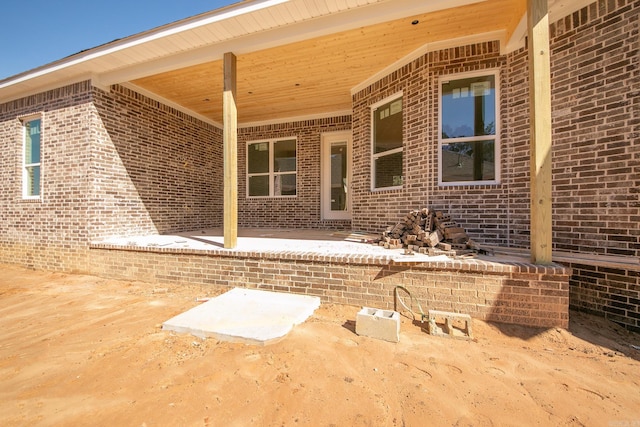 entrance to property with brick siding