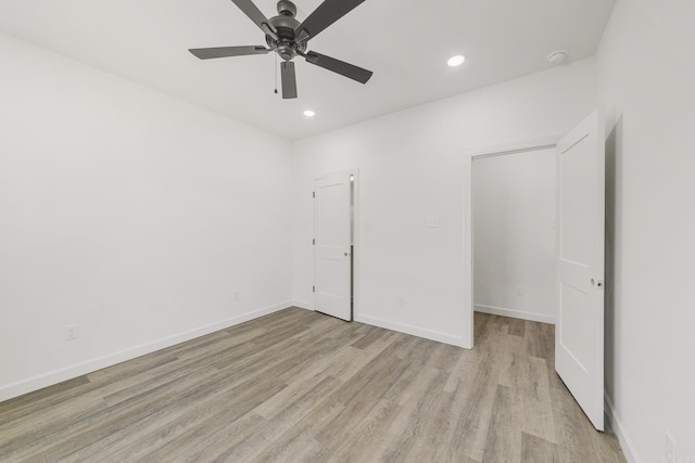 unfurnished bedroom with light wood-style flooring, recessed lighting, ceiling fan, and baseboards