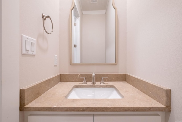 bathroom with visible vents and vanity