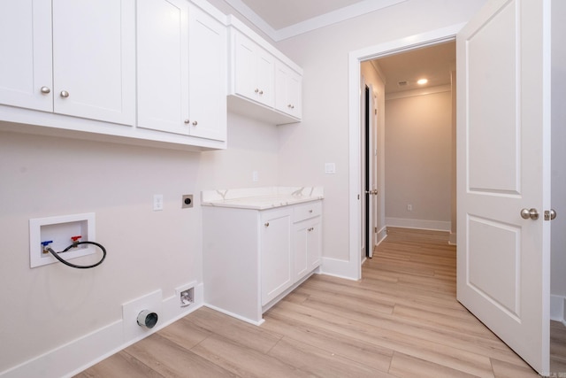 clothes washing area featuring light wood-style flooring, washer hookup, baseboards, cabinet space, and electric dryer hookup